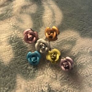 Vintage gold tone floral cross with rhinestone center Brooch